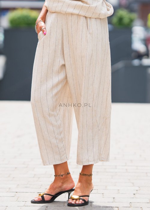 Lniane spodnie damskie w kolorze beżowym w cienkie paski, o luźnym kroju 7/8