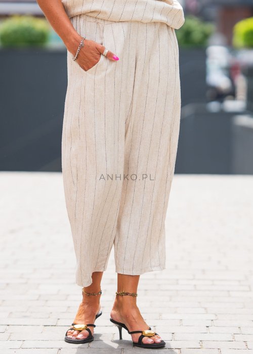 Lniane spodnie damskie w kolorze beżowym w cienkie paski, o luźnym kroju 7/8
