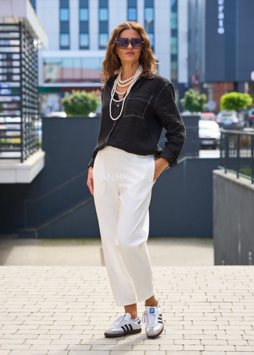 Białe spodnie damskie z wysokim stanem, luźna nogawka, elegancki minimalistyczny krój