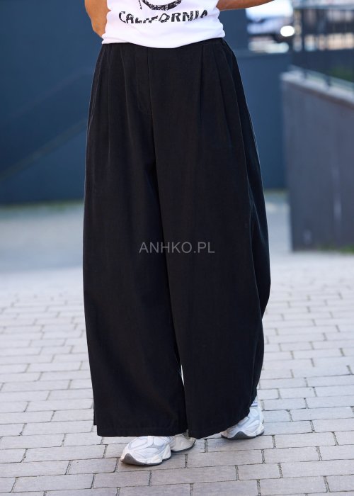 Komplet damski w kolorze czarnym– luźny żakiet z dużymi kieszeniami i szerokie spodnie z wysokim stanem, stylowa elegancja na co dzień