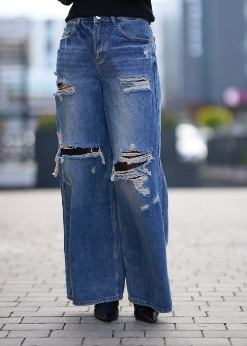 Szerokie jeansy z przetarciami i dziurami, denimowe spodnie w stylu oversize