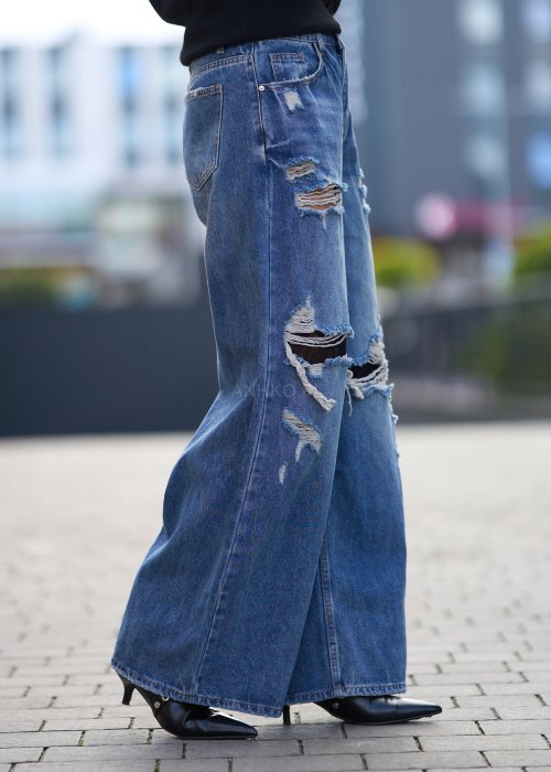 Szerokie jeansy z przetarciami i dziurami, denimowe spodnie w stylu oversize