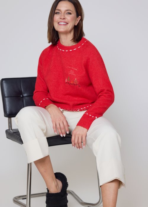 Materiałowe spodnie ecru o prostym kroju z szerokimi mankietami