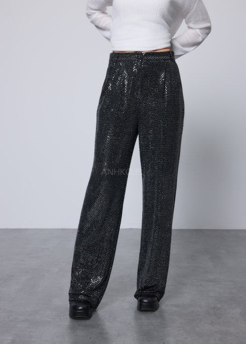 Czarne szerokie spodnie o połyskującej, cekinowej fakturze