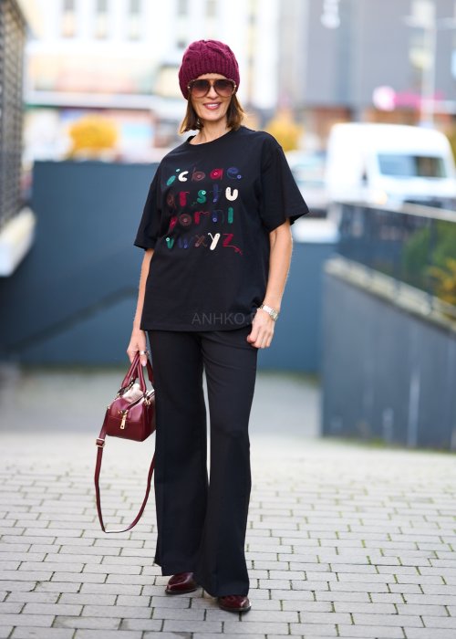 Czarne eleganckie spodnie z rozszerzanymi nogawkami