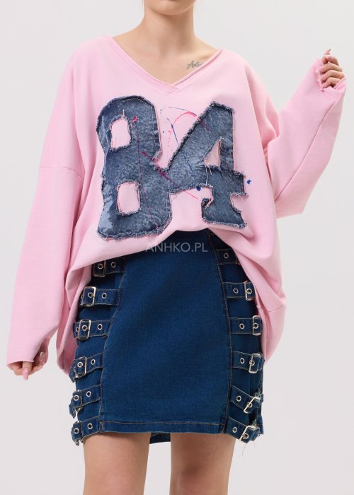 Jeansowa spódniczka mini Karla z ozdobnymi klamrami po bokach, styl streetwear.