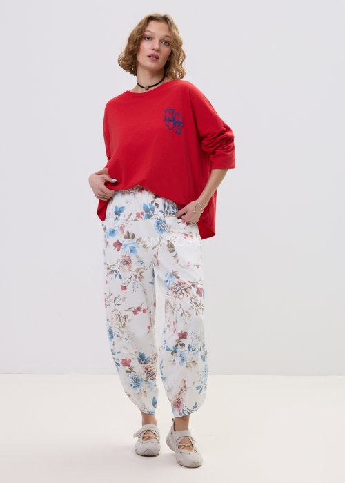 Spodnie damskie w kwiatowy print z szeroką nogawką i kieszeniami cargo – luźny fason z elastyczną talią i pastelowym wzorem