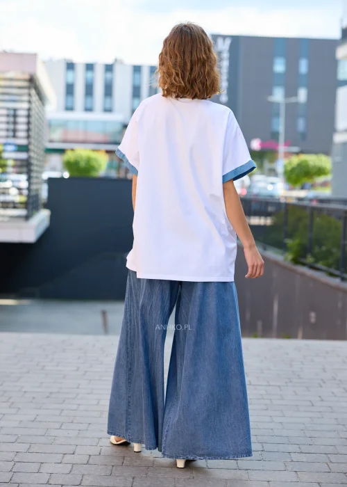 Spodnie damskie niebieskie z efektem spranego denimu, o szerokich nogawkach i elastycznej talii.
